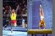 A double image of gymnasts Li Xiaopeng (China) left and Simona Amanar (Romania) right, competing in their respective Vault finals at the Sydney 2000 Olympic Games.