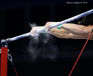 A generic images of the hands of a gymnast competing on High Bar at the 2014 Glasgow Commonwealth Games.