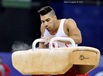 Louis Smith (England) blows away the chalk before competing on Pommel Horse at the 2014 Glasgow Commonwealth Games.