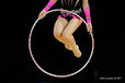 A cropped generic image of a gymnast jumping through the Hoop while competing at the World Rhythmic Gymnastics Championships in Montpellier