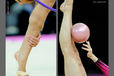 A cropped generic image of a gymnasts competing with Hoop and Ball at the World Rhythmic Gymnastics Championships in Montpellier.
