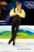 A generic blurred motion image of a male skater performing a jump during his free programme at the 2010 Winter Olympic Games in Vancouver.