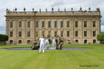 Local youth Ben Hope holds the Olympic Torch and Flame in front Chatsworth House in Derbyshire during the Torch Relay.