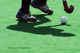 A cropped generic image of the shadow of a player's shadow with the ball perfectly balanced on the stick at the 2010 Women's World Cup Tournament in Nottingham.