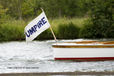 The Umpire's flag flies on the prow of a launch at the 2010 Women's Henley Regatta