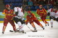 Switzerland's Kathrin Lehmann comes under pressure during their Women's Ice Hockey match against China.