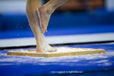 A cropped generic image of the feet of a gymnast preparing to compete on Vault.