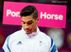 A portrait image of Louis Smith (Great Britain) in thoughtful mood as he waits to compete in the Gymnastics competition at the London 2012 Olympic Games.