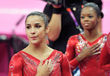 Alexandra Raisman and Gabrielle Douglas (USA) wait expectantly for the results of the team competition during the women event at the London 2012 Olympic Games. 