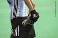 A cropped action portrait of an Argentinian player stretching her leg muscles before their match against China at the 2010 Women's World Cup Hockey Tournament in Nottingham.