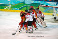 Swiss and Chinese players line up to attack or defend the goal during their match at the 2010 Winter Olympic Games in Vancouver