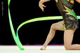 A cropped generic image of a gymnast competing with Ribbon at the World Rhythmic Gymnastics Championships in Montpellier.