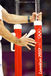 A coach adjusts the parallel bars during the Gymnastics competition at the 2012 London Olympic Games.