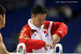 Zhang's coach checks the handles