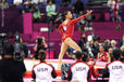 Alexandra Raisman (USA) is the centre of attention as she competes on floor exercise during the gymnastics competition of the London 2012 Olympic Games.