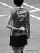 Ayane Kurihara (Japan) signals her service intention to her partner during a double match at the 2016 All England Badminton Championships at the Barclaycard Arena Birmingham