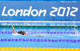 A generic image of a swimmer doing backstroke in front of the London 2012 logo at the swimming competition of the London 2012 Paralympic Games.