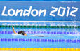 A generic image of a swimmer doing backstroke in front of the London 2012 logo at the swimming competition of the London 2012 Paralympic Games.