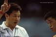 Huang Yubin the National Men's coach of China advises his gymnast Lu Yufu on the finer points of technique.