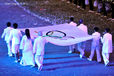 The Olympic Flag is carried in to the stadium during the Opening Ceremony at the London 2012 Olympic Games.