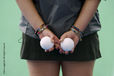 A cropped generic image of a ball girl waiting at the sideline during a match at the 2010 Women's World Cup Hockey Tournament.