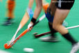 A blurred motion generic image of a Dutch and German players in a tackle during their match at the 2010 Women's World Cup Hockey Tournament in Nottingham.