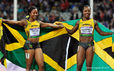 Shelly-Ann Fraser Price and Veronica Campbell-Brown (Jamaica) pose with the national flag after their success in the 100 metres at the 2012 London Olympic Games.