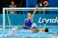 The Russian goalkeeper Maria Kovtunovskaia saves a shot at goal during their Water Polo match against Australia.