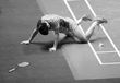 Wang Shixian (China) misses a shot in his singles match at the 2016 All England Badminton Championships in the Barclaycard Arena in Birmingham