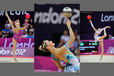 Fingertip control with the Ball demonstrated by Frankie Jones (Great Britain), Chrystalleni Trikomiti (Cyprus) and Jana Berezko-Marggrander (Germany) during the Rhythmic Gymnastics competition of the London 2012 Olympic Games.