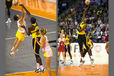 A double action image of players leaping for the ball during the 2010 World Series Netball Championships in Liverpool in the matches between Jamaica and Australia (left) and Jamaica and England (right).