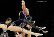 A cropped action image of the group from Bulgaria training a difficult and original move at the World Rhythmic Gymnastics Championships in Montpellier.