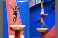 Two action images of Mans Stenberg (Sweden) left and Peter Marjan (Hungary) right competing on Vault at 2009 London World Artistic Gymnastics Championships at the 02 arena.