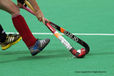 A cropped generic action image of an England player getting to the ball first but finding the way out blocked by an New Zealand player during their match at the 2010 Women's World Cup Hockey Tournament.