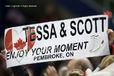 Spectators at the Figure Skating event hold up a message of support for Canadian ice dancers Tessa Virtue and Scott Moir at the 2010 Winter Olympic Games in Vancouver