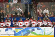 The Canadian women's ice Hockey team look on and support their players out on the ice during their match against Slovakia at the 2010 Winter Olympic Games in Vancouver.