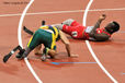 Amu Fourie (South Africa) and Blake Leeper (USA) take a tumble at the end of the final of the 200 metres T44 event in the Athletic competition at the London 2012 Paralympic Games.