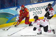 China's Yu Baiwei finds herself under pressure from Melanie Hafliger (29) and Sara Benz (13) of Switzerland in their match at the 2010 Winter Olympic Games in Vancouver.