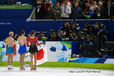 The medal winners from the Ladies Figure Skating event pose for photographers at the 2010 Vancouver Winter Olympic Games.