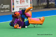 China's goalkeeper Zhang Yimeng takes a tumble saving a shot at goal during their match against Argentina at the 2010 Women's World Cup Hockey Tournament in Nottingham.