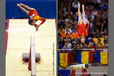 Yang LinLin and Deng Linlin (China) perform difficult and risky somersaults on Balance Beam at the 2009 London World Artistic Gymnastics Championships