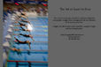 A generic blurred action image of swimmers diving into the pool at a takeover of a relay race.