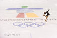 A generic imafe of a female figure skater perfroming a spin on the Olympic logo stained into the ice at the Pacific Coliseum at the 2010 Winter Olympic Games in Vancouver.