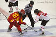 Swiss and Chinese players face off during their match at the 2010 Winter Olympic Games in Vancouver
