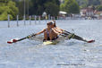 An action portrait image of a combined SJ4x crew during their race at the 2010 Women's Henley Regatta.